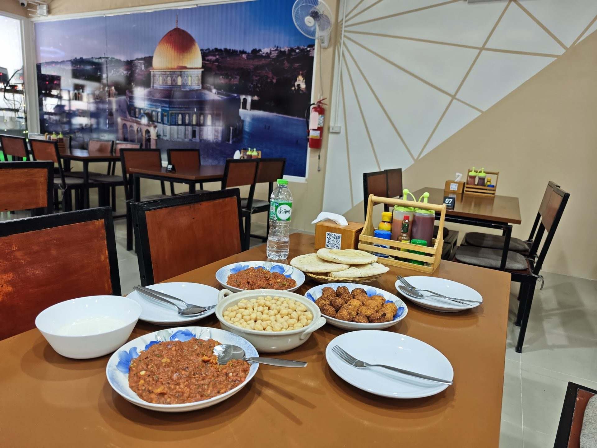 A hearty breakfast served with fresh bread and dips